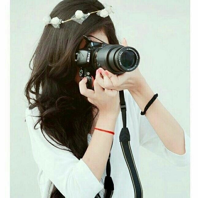 Girl Holding Camera Profile Picture